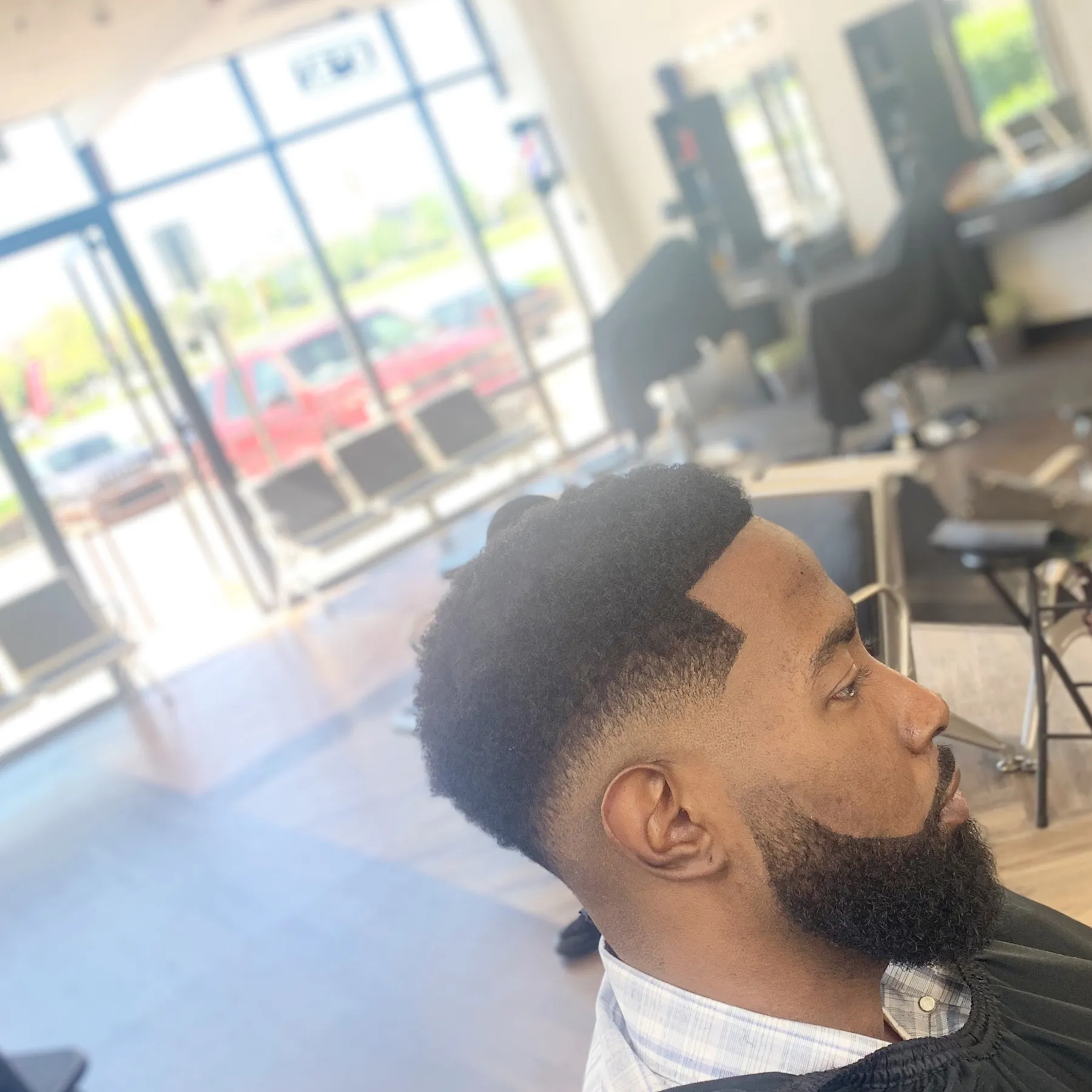 Taper fade with beard lineup at VIP Barber Lounge Aurora